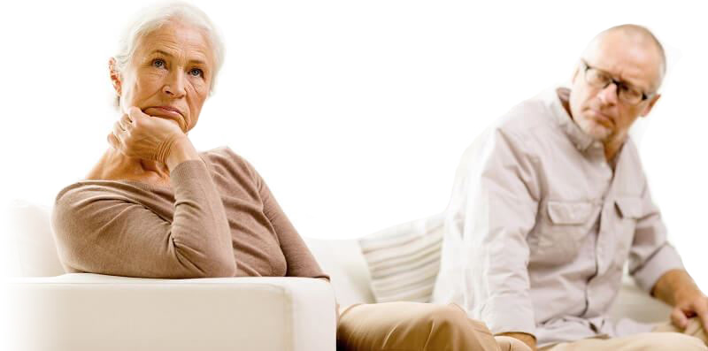 older unhappy couple sitting down
